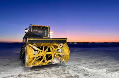 Large snow blower with sunset