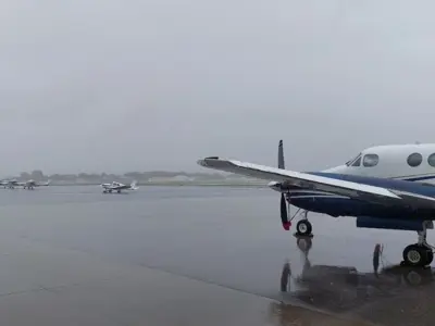 Grounded airplanes with cloudy sky