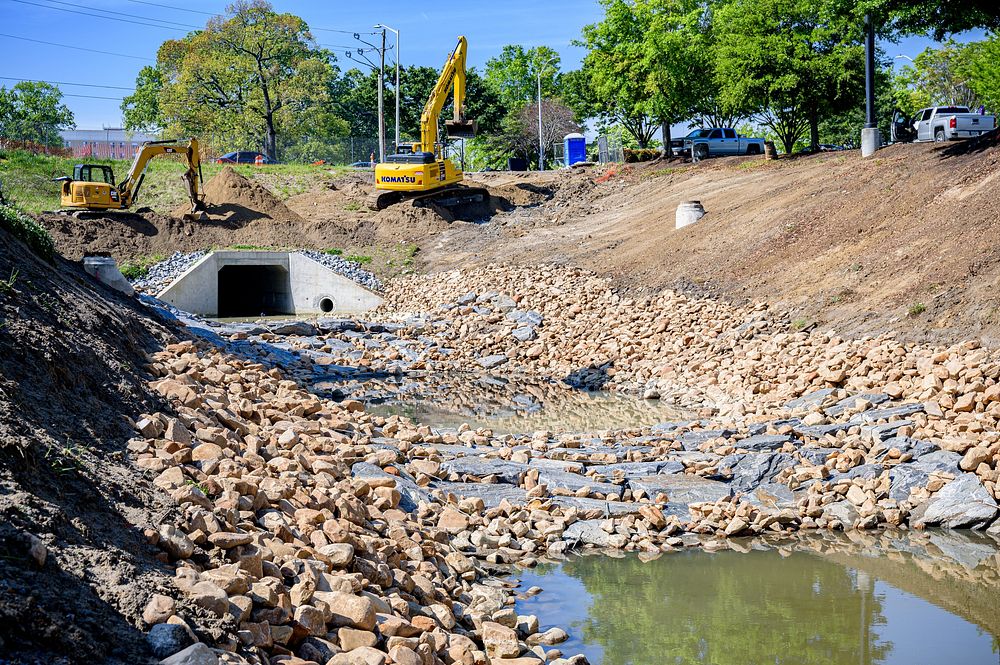 Large culvert with rock and water