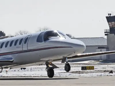 Airplane with tower in background