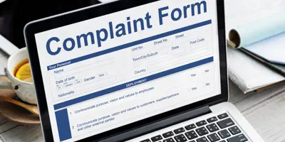 Laptop screen showing complaint form